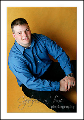 Kansas City Senior Photographer senior boy yellow backdrop