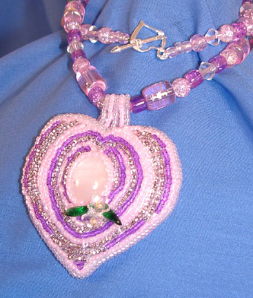 [pink-purple-heart-necklace.jpg]