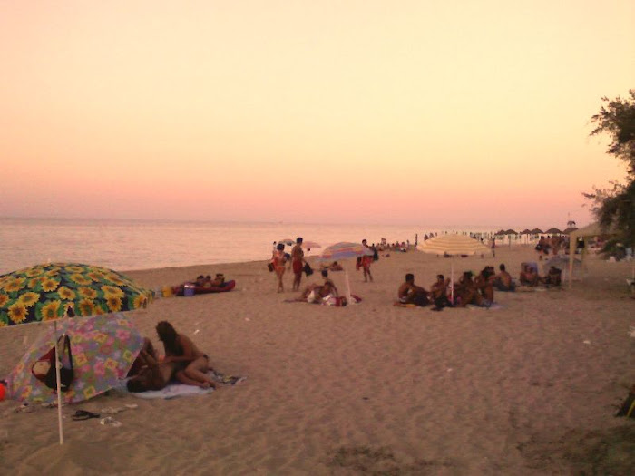 *People on the Monopoli Duna Beach at the Sunset*