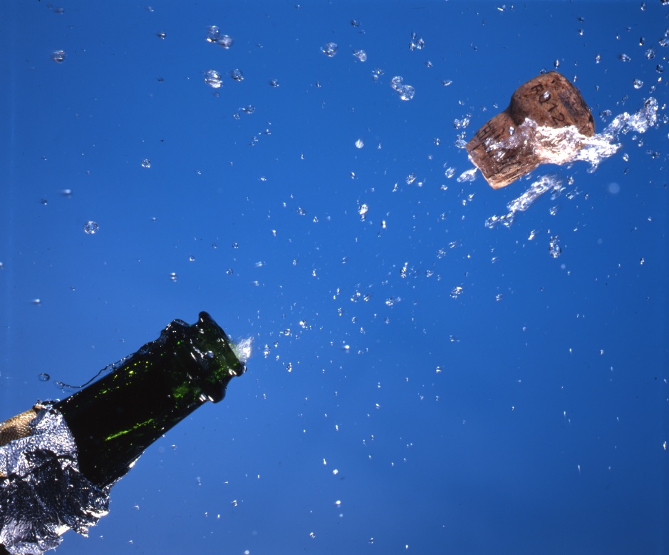 [champagne-cork-popping-flying-water-liquid-drops-on-blue-AJHD.jpg]