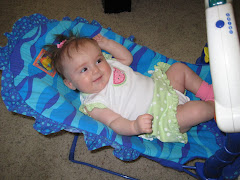 Hannah and her aquarium bouncy seat