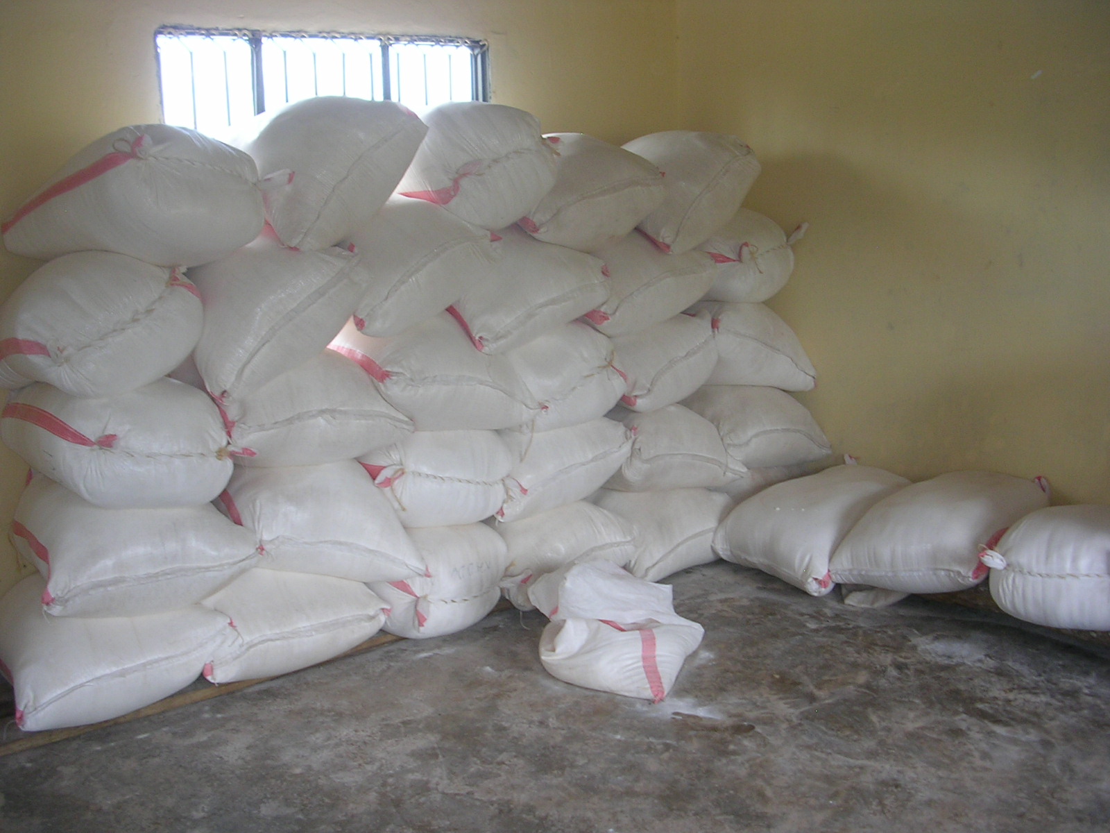 [Ngogwe+CBO+warehouse+with+100+lb+sacks+of+corn+flour.JPG]