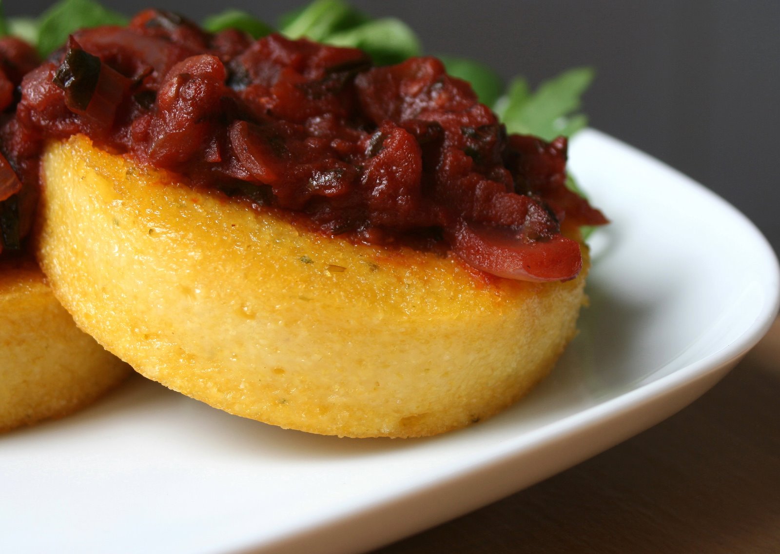 [moving+polenta+with+rich+tomato+sauce.JPG]