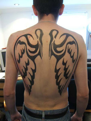 This tattoo uses two common designs to create one unique piece - angel wings 