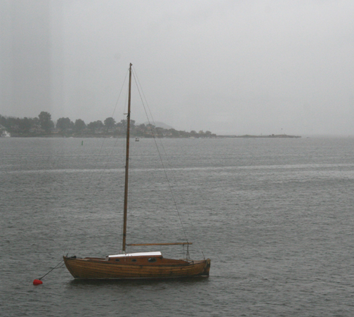 [wooden+boat+in+harbor.jpg]
