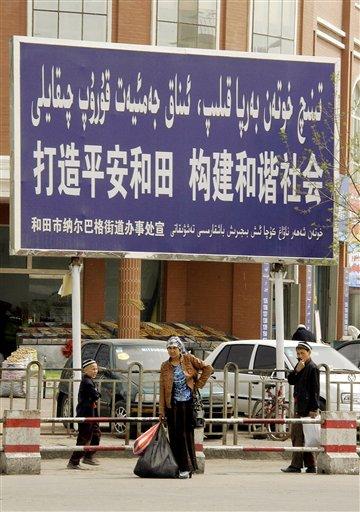 [_propaganda_saying_in_Chinese_Built_Peaceful_Hotan__Create_Harmonious_society_in_Hotan_northwest_Chinas__Xinjiang_Uighur_Autonomous_Region_on_Saturday.jpg]
