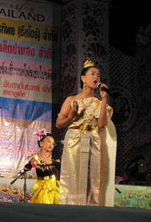 Another young singer with dancers