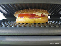 Bagel sandwich on panini grill