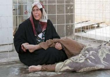 Iraqi woman mourning her killed son
