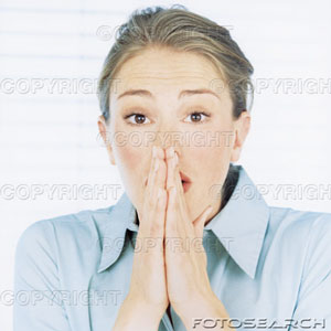 [woman-holding-hands-in-prayer-position-over-mouth-portrait-close-up-~-200254702-001.jpg]