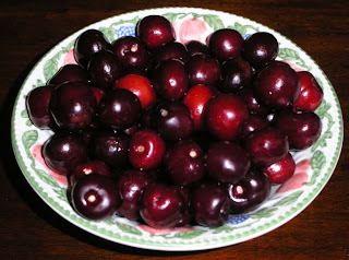 Cherries in a dish decorated with cherries