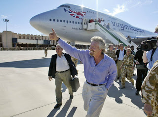 a man walking towards an airplane