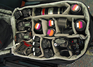 a bag full of camera lenses and lenses