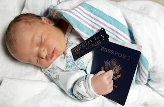 a baby sleeping with a passport