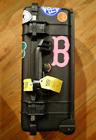 a black case with a pink and green letter