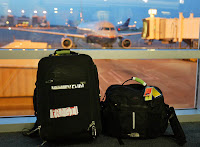 two luggage bags in front of an airport