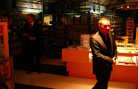 a man in a suit walking in a room