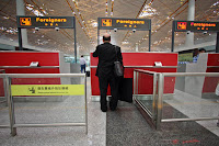 a man standing in a check-in counter