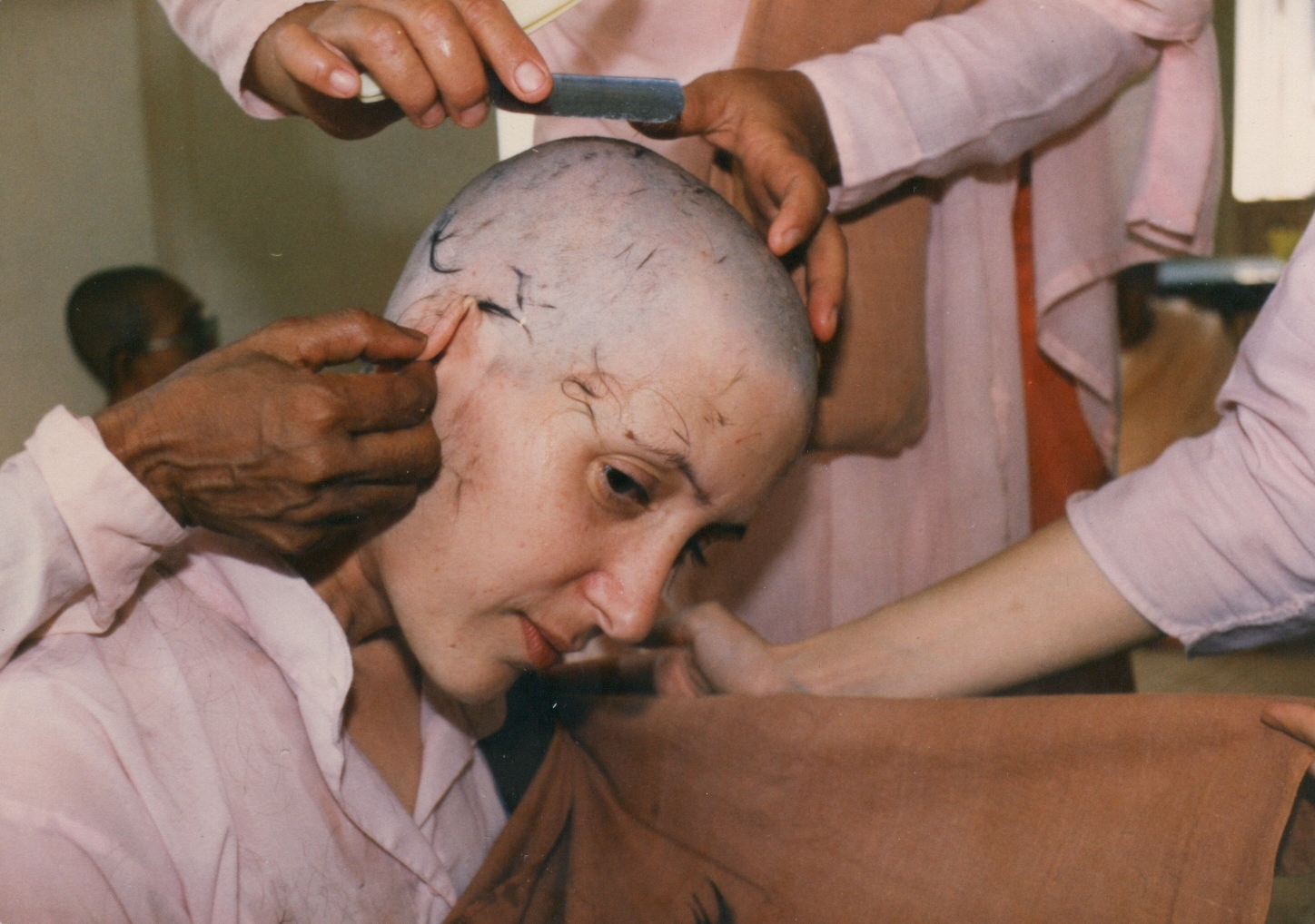 First head shave finishing touches, Burma, 1988