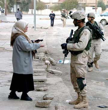 [Iraqi-woman-with-soldier.jpg]