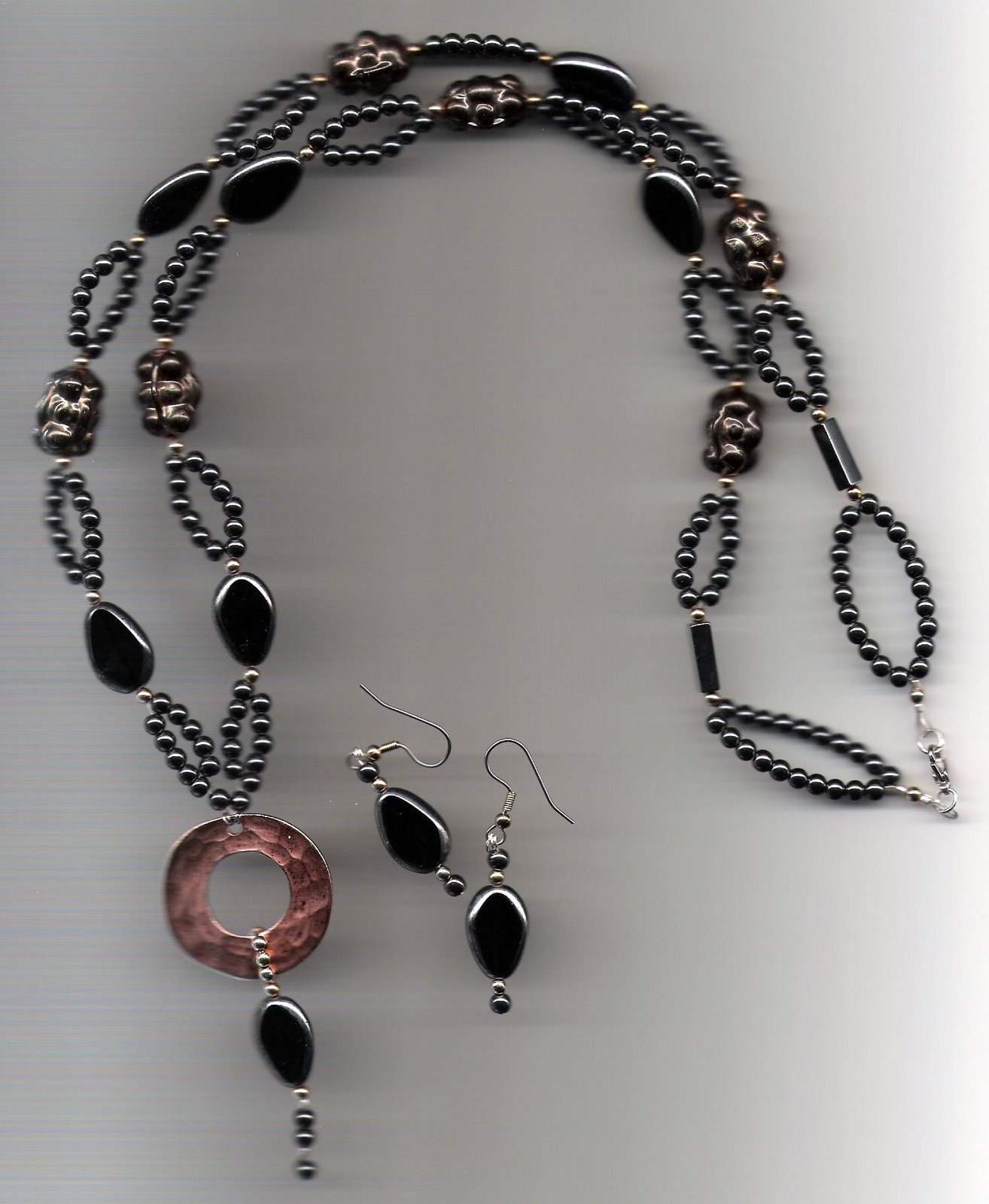 [hemitite,+black+glass+beads,+copper+donut+&+India+poopi+beads_2.jpg]