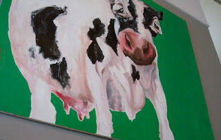 GBB artwork on the wall - a large cow surveying the beef-eating customers
