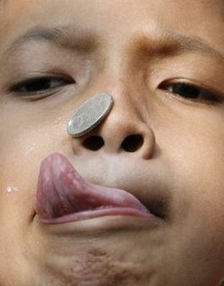 [kid+lick+coin.JPG]