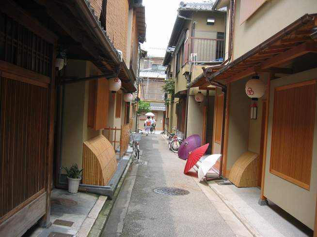 Geisha house and geisha in the tiny streets of Gion