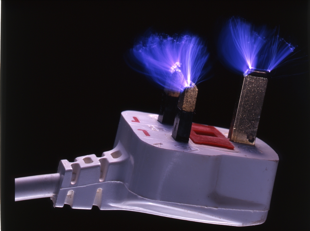 [electrical-discharge-in-multiple-sparks-from-prongs-pins-of-UK-electric-mains-plug-3-prong-fuse-carrier-in-base-rescan-rescan-rescan-AJHD.jpg]
