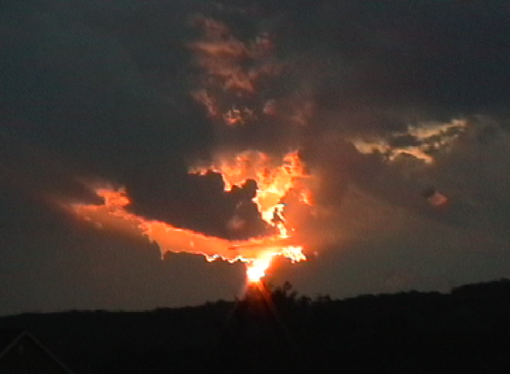 [sunset+through+clouds.JPEG]