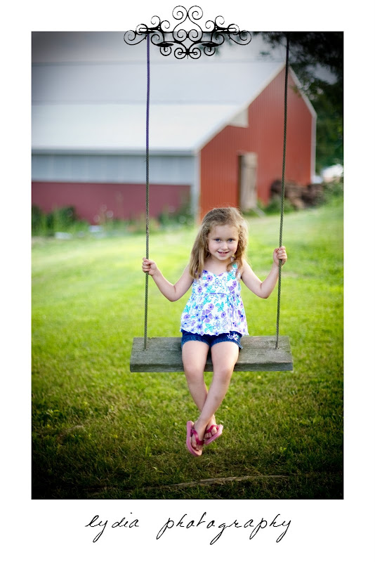 Little girl on the swign at lifestyle kids portraits on a farm in Indiana, Pennsylvania