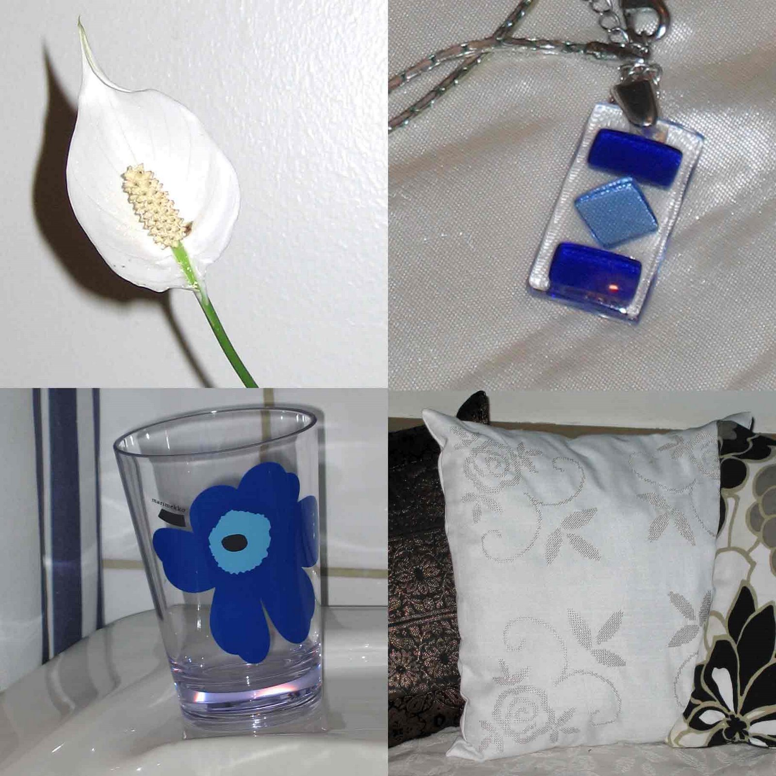 Vit fredslilja, blått halssmycke från Kreta, blå Marimekko-mugg, vit kudde
