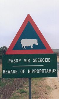 [200px-Beware_of_hippopotamus.jpg]