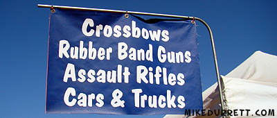 Sign: Crossbows, Rubber Band Guns, Assault Rifles, Cars & Trucks