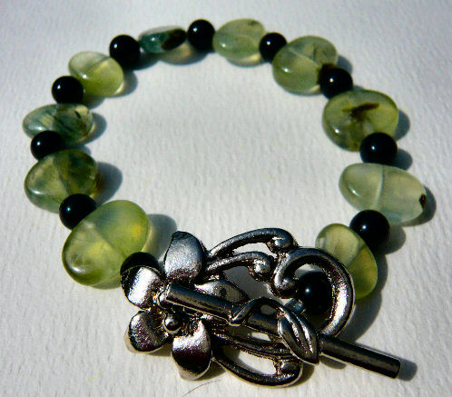 [prehnite,+and+black+agate+bracelet+with+silver+plated+flower+toggle.jpg]