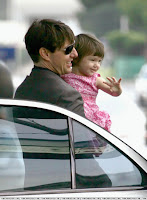 Tom and Suri Cruise leaving a hotel in France