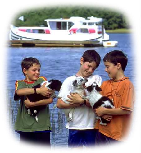 [-framedkids_with_dogs_boat.jpg]