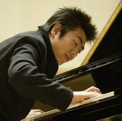He is a hot artist on classical music who has modern spiky hairstyle.