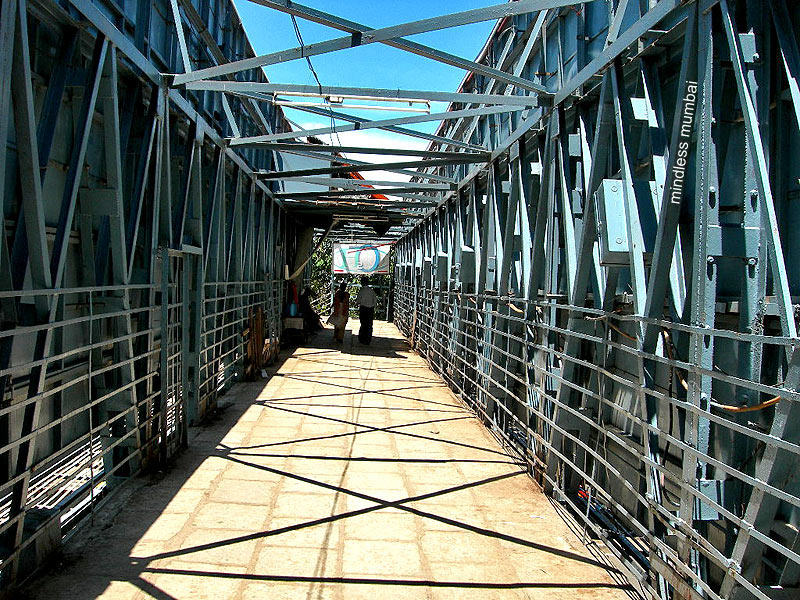 steel framed pedestrian foot over bridge at charni road, marine drive, mumbai