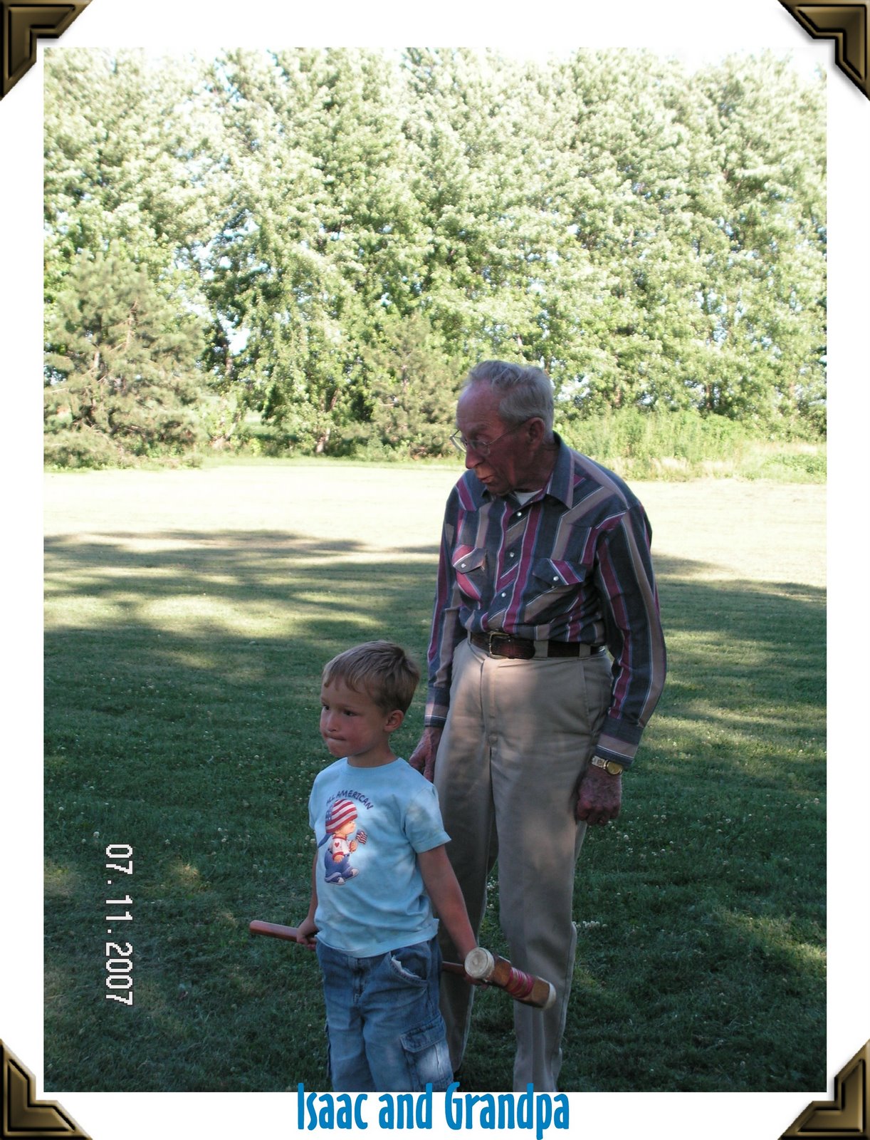 [isaac+and+grandpa+playing+kroque.jpg]