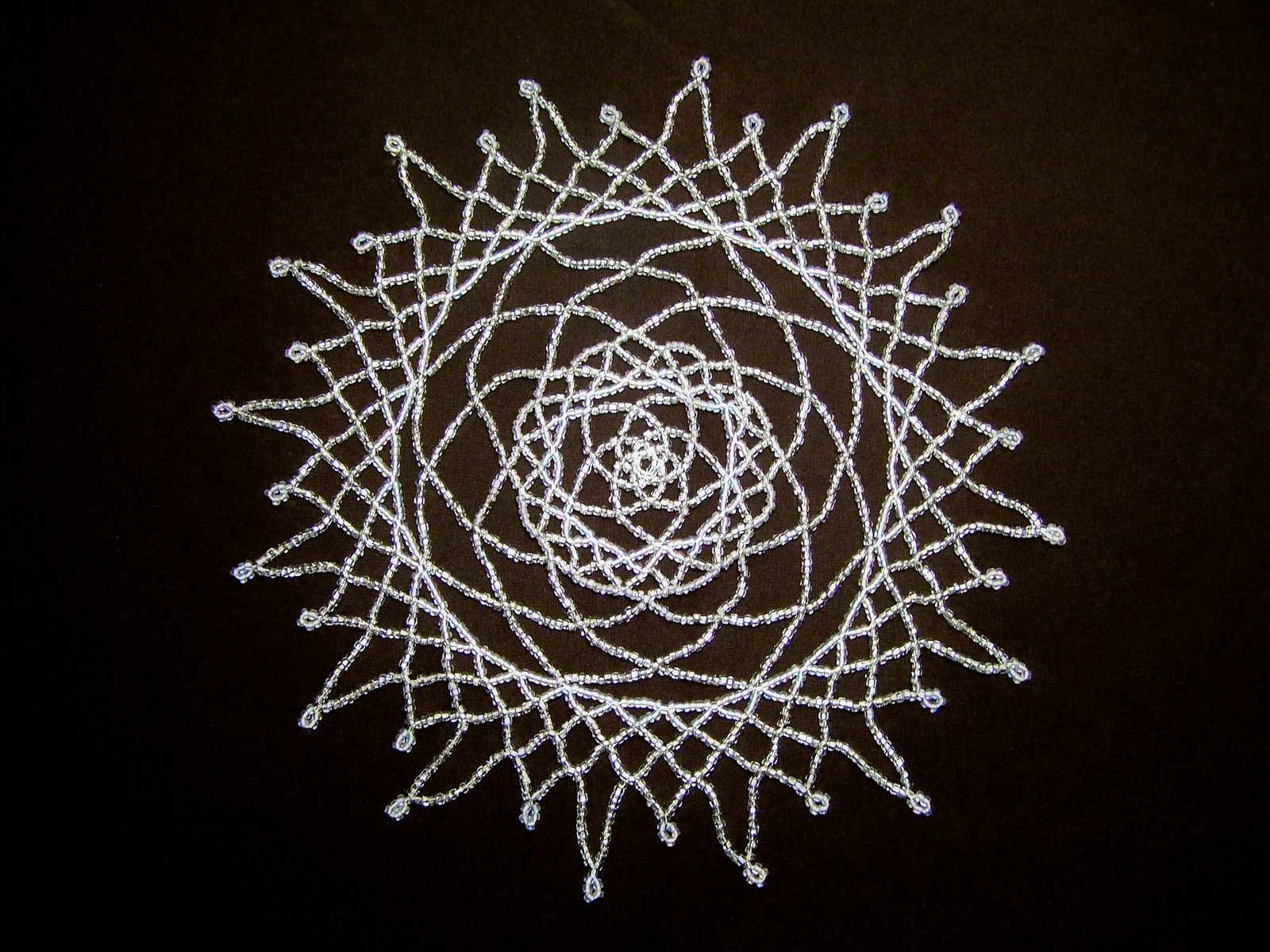 [silver+doily+on+brown.jpg]