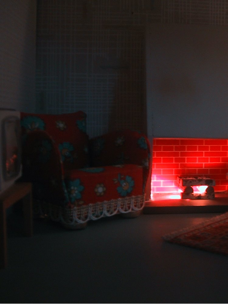 Vintage 1967 Lundby dollshouse lounge with fireplace lit up at night.