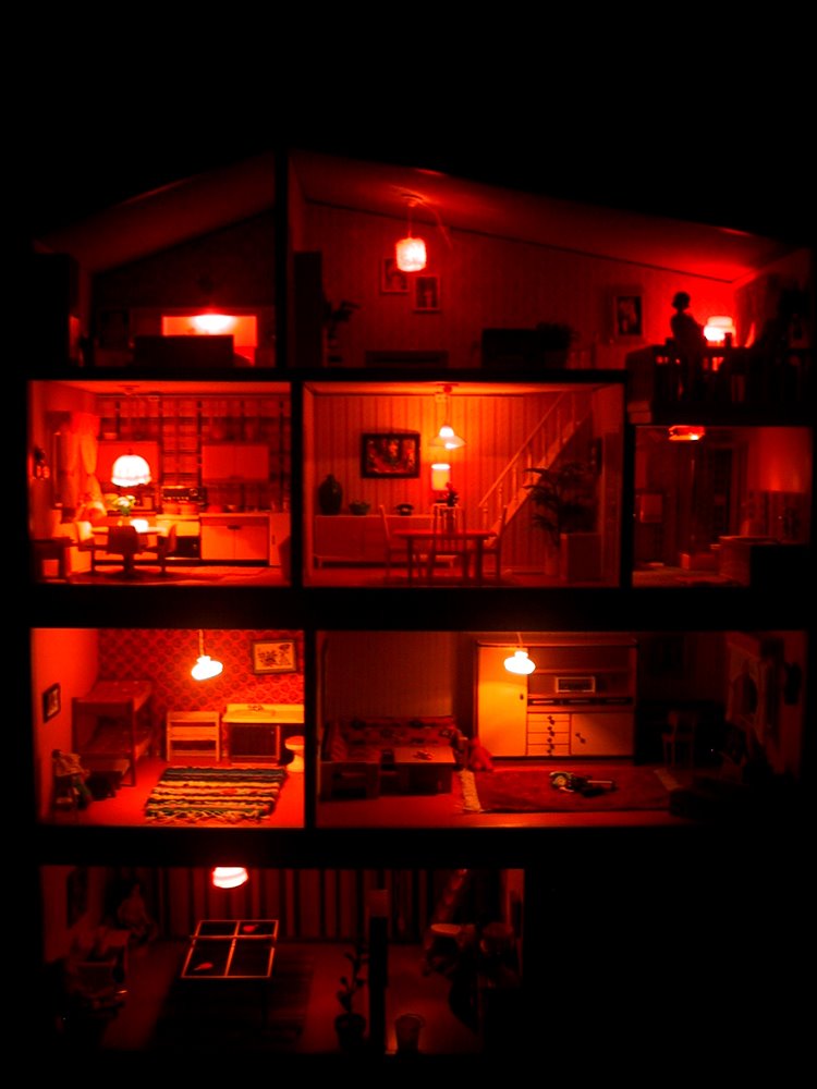 Vintage mid-seventies Lundby dolls' house, lit up at night.