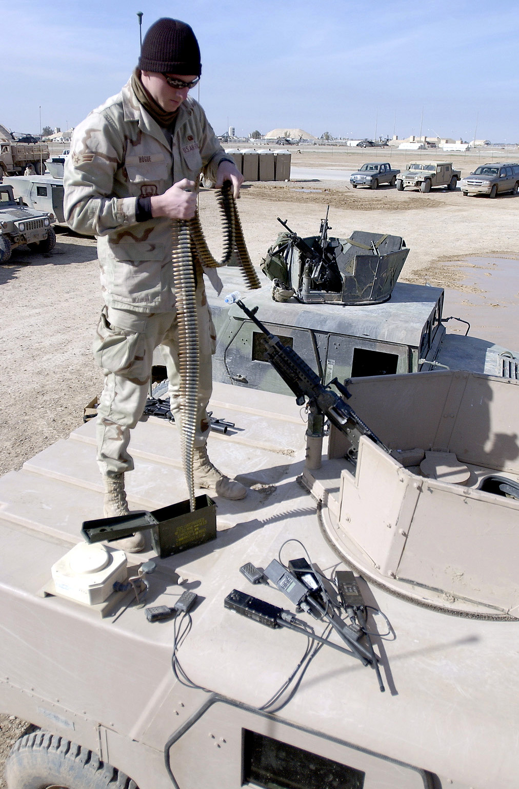 [Iraq.Airman+1st+Class+Andrew+Hose+inspects+rounds+before+he+and+other+Task+Force+1041+Airmen+go+on+an+off-base+patrol..jpg]