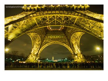 [BN14496_1~Line-of-Tourists-Queuing-Under-Eiffel-Tower-at-Night-Paris-France-Posters.jpg]