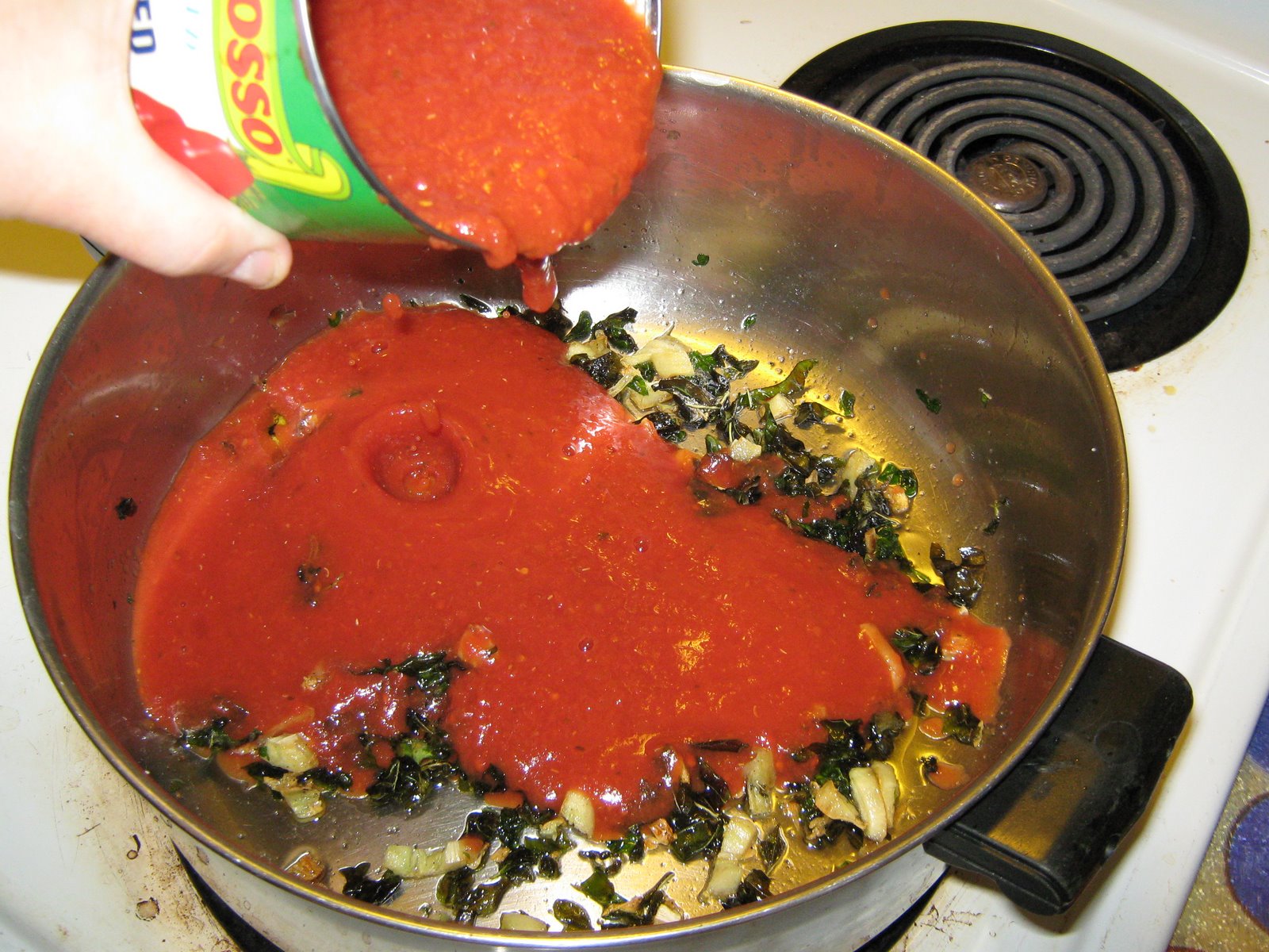 [tomato.sauce.herbs.garlic.simmering.6.08.jpg]