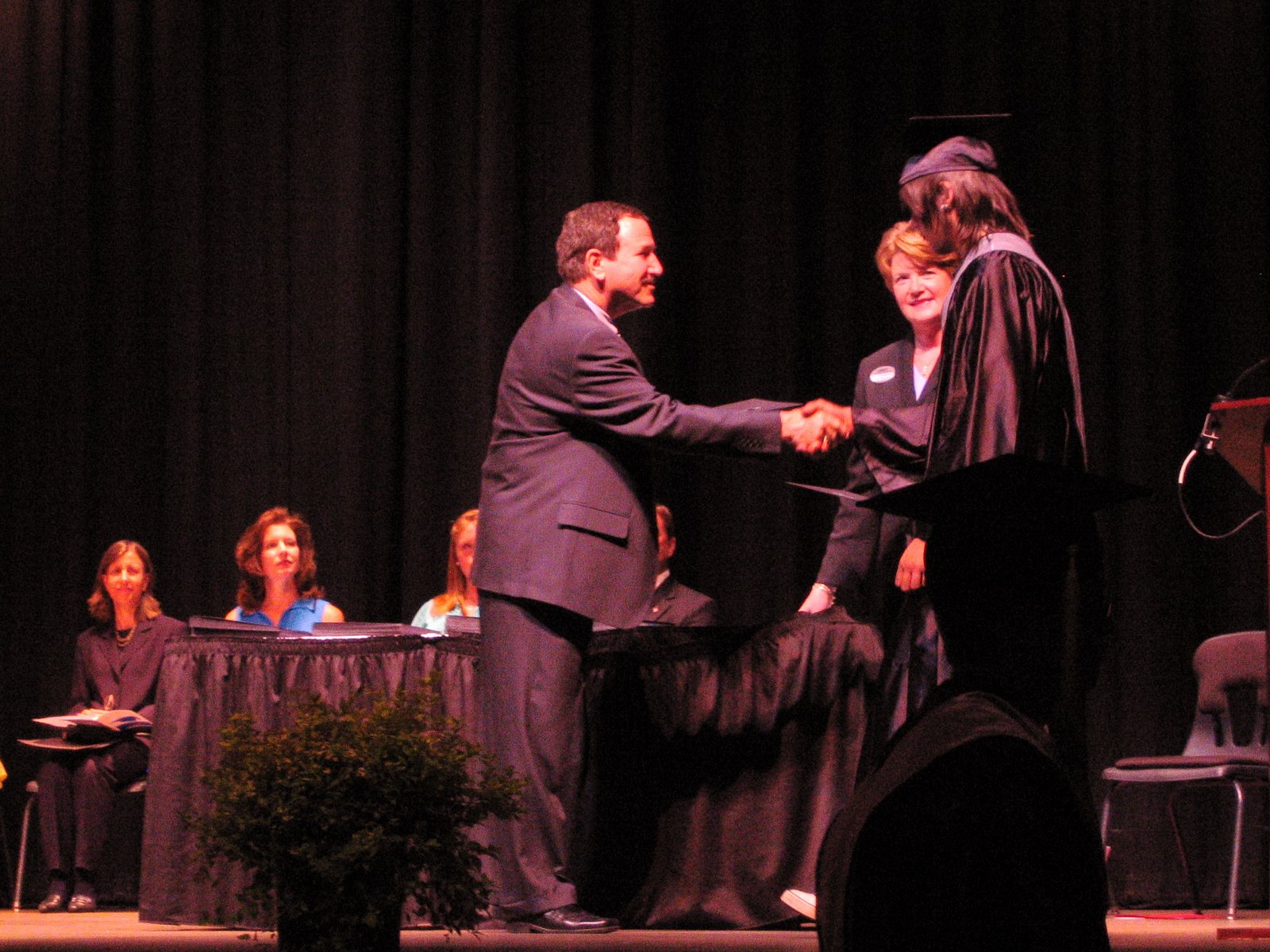The Boy receives his diploma