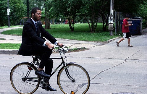 Image of bicyclist in a suit