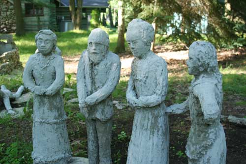 Four concrete figures, close up
