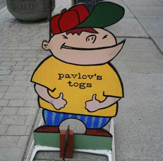 Painted sign of a kid, labeled Pavlov's Togs